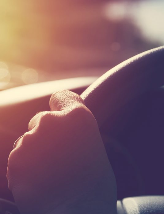 Female hand on steering wheel. Travel and safty concept. Female hand on steering wheel. Travel and safty concept.